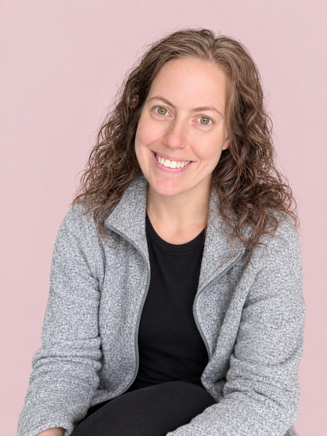 Tiana Langevin seated against a soft pink background